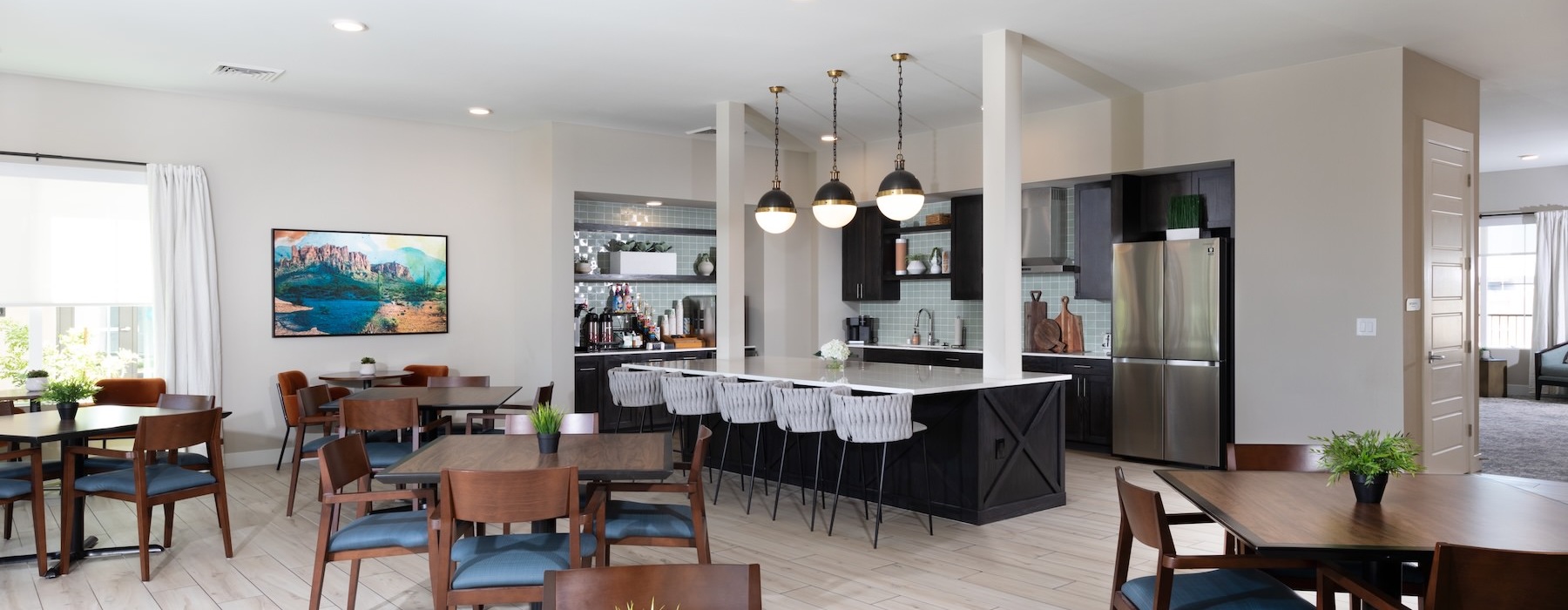 a clubroom with tables and chairs