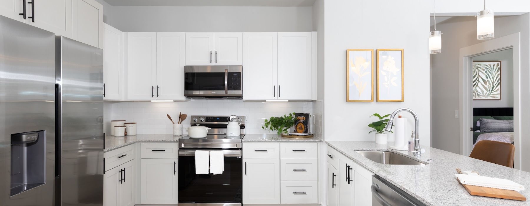 a kitchen with white cabinets